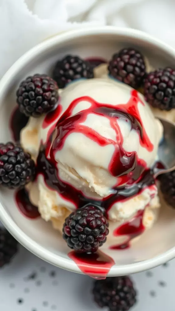 A bowl of blackberry and lemon ice cream topped with fresh blackberries and a drizzle of berry sauce.